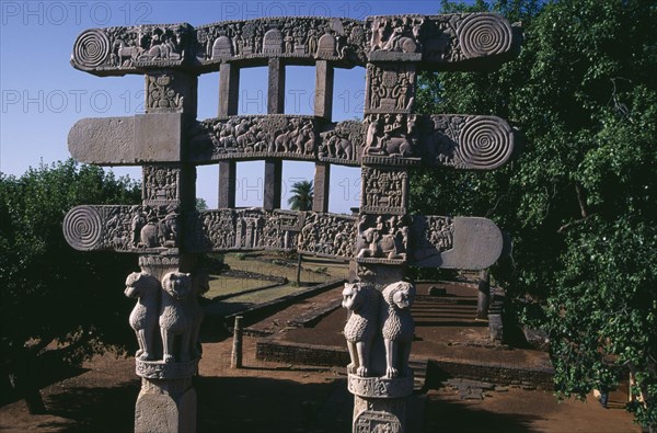 INDIA, Madhya Pradesh, Sanchi, Southern Gateway of the Great Stupa carved with scenes from the life of Buddha and events from Ashokas life as a Buddhist.