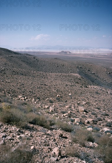 IRAN, Fars Province, East Of Shiraz, View from hills down towards a salt lake in the valley below