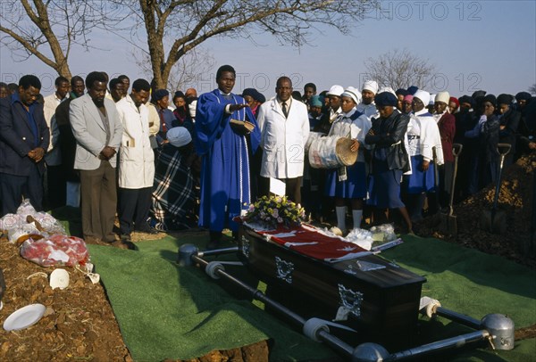 SOUTH AFRICA, Eastern Cape, Kraal, Hammaus.  Burial service at Christian funeral.