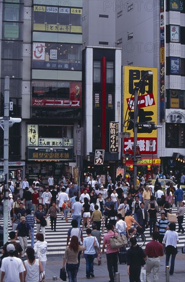 JAPAN, Honshu, Tokyo, Ueno. Busy pedestrian crossing in city street