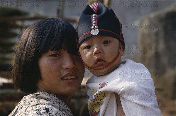 THAILAND, North, Portrait of two Akha tribe children near Chiang Rai.