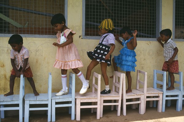 SRI LANKA, Colombo, Children learing to count through game playing.