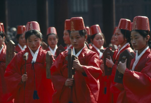 SOUTH KOREA, Seoul, Sung Kyon Kwan University.  Sukcheon ceremony to consecrate confucius.  Dancing by traditional eigtht rows of eight carrying carved and painted rattles.