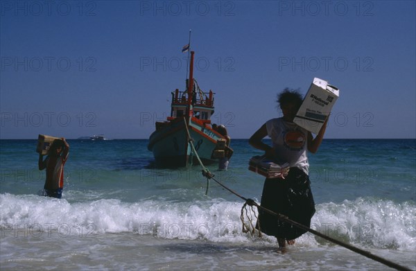 20061024 THAILAND  Ko Samet People bringing in supplies from boat moored off shore.