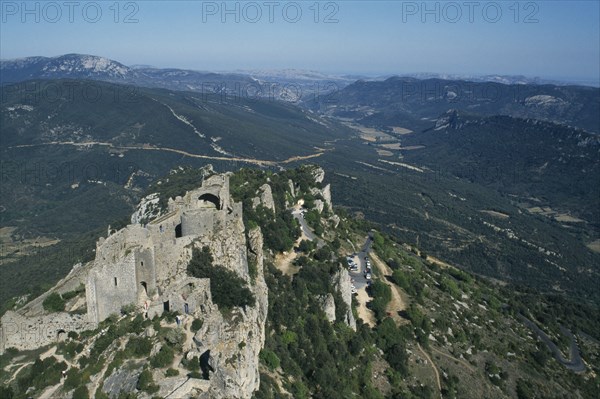 FRANCE, Languedoc Roussillon, Aude, Peyrepertuse Cathar Castle.  Ruined fortifications of eleventh century castle on rocky hillside.