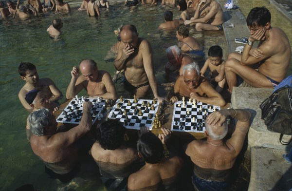 HUNGARY, Budapest, Szechenyi Furdo.  Chess players in thermal baths of spa.