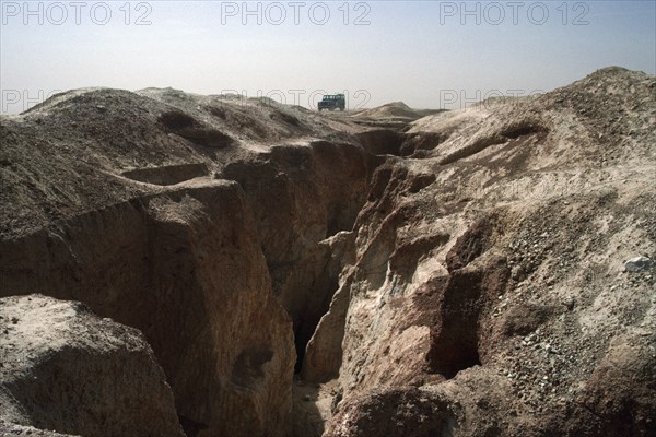 BURKINA FASO, Sahel, Landrover on ridge of land above old gold workings.