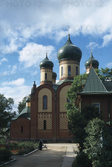 ESTONIA, East, Buildings, Puhtitsa Russian Orthodox Convent.  Exterior facade with onion dome rooftops and gardens.