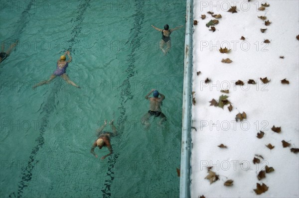 HUNGARY, Budapest, People swimming lengths in Luca thermal baths.