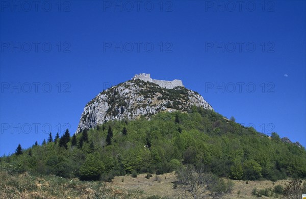 FRANCE, Languedoc Roussillon, Aude, Ruins of eleventh century Peyrepetuse Cathar Castle on top of rocky hillside.