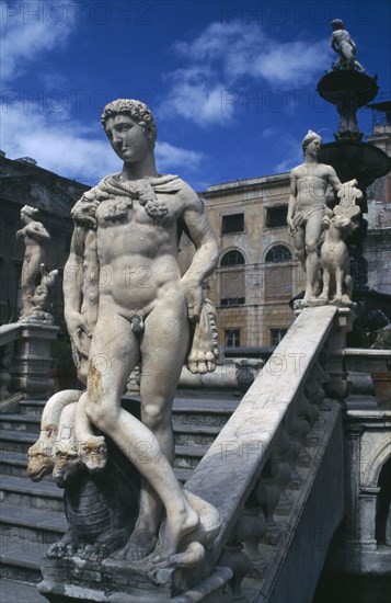 ITALY, Sicily, Palermo, Classical statuary and staircase.