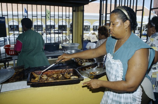 WEST INDIES, Dutch Antilles, Curacao, Willemstad.  Female cook.