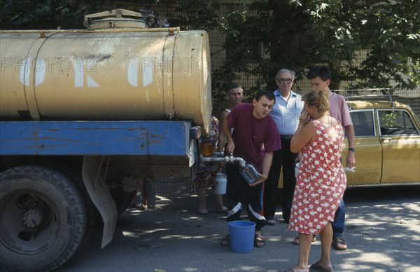 UKRAINE, Odessa, Milk tanker delivering milk to people living in the city suburbs.