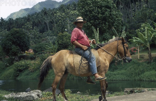 PACIFIC ISLANDS, Polynesia, French Polynesia, "Marquesas. Taipivai, Nuku Hiva.  Horserider."