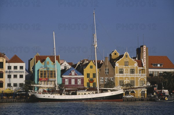 WEST INDIES, Dutch Antilles, Curacao, Willemstad.  Waterfront buildings and moored sailing ship.