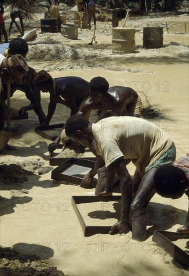 GHANA, Industry, Mining, Sieving for diamonds.