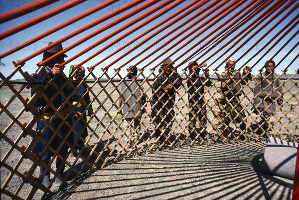 MONGOLIA, Tribal People, Communal erection of yurt for newly married couple as part of traditional wedding ceremony.