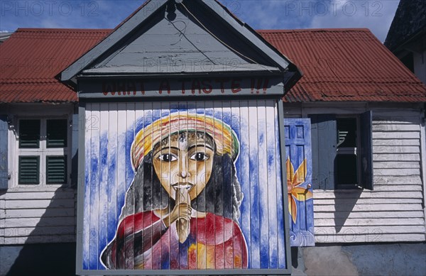 WEST INDIES, Windward Islands, Dominica, Roseau.  Mural on exterior of bread shop in the centre of the capital.