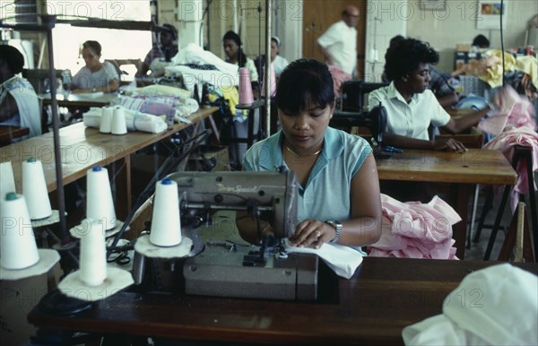 WEST INDIES, Antigua, Coolidge, Workers at sewing machines on floor of Eagle Garment Company.