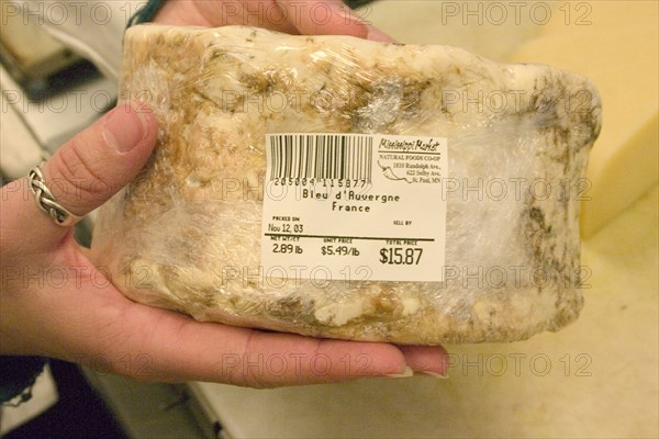 USA, Minnesota, St Paul, "A large package of Bleu d'Auvergne Cheese from France, ready for the display case in the cheese shop at the Mississippi Market a natural foods co-op located at Dale and Selby."