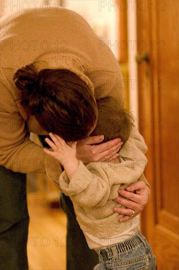 USA, Minnesota, St Paul, Mother comforting her young son in a moment of need