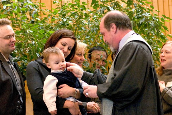 USA, Minnesota, St Paul, Minister performing Naming Ceremony for children in the sanctuary of Unity Church Unitarian.