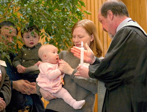 USA, Minnesota, St Paul, Minister performing Naming Ceremony for children in the sanctuary of Unity Church Unitarian.
