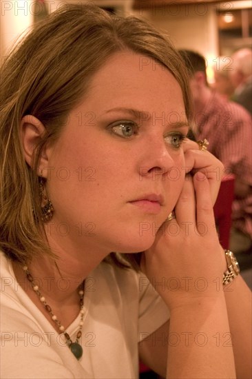 USA, Minnesota, Plymouth, Woman aged 29 quietly waiting for food at the Red Lobster restaurant.