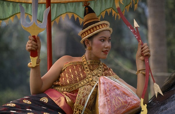 LAOS, Luang Prabang, Young woman dressed as Goddess of the Year during New Year celebrations.