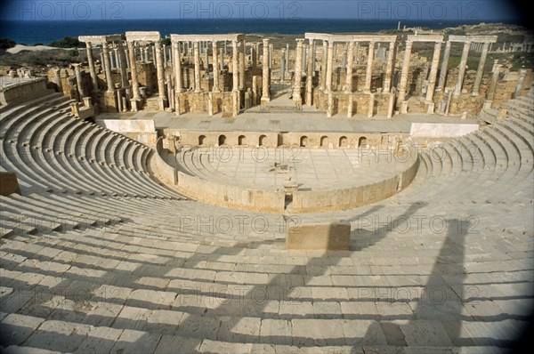 LIBYA, Tripolitania, Leptis Magna, Ruins of Roman city founded in 6th Century BC.  Carved columns and masonry in the theatre.