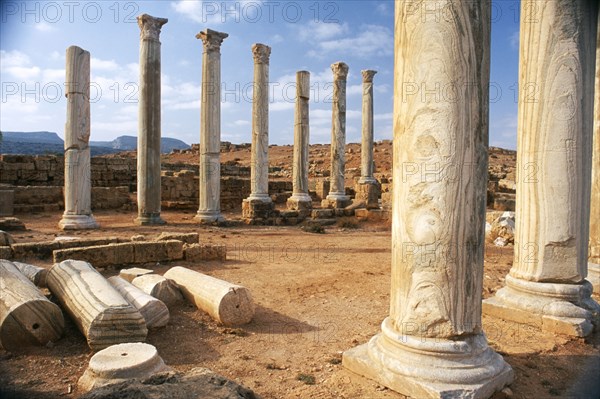 LIBYA, Cyrenaica, Apollonia, Ancient harbour of Cyrene and a city in its own right.  Colonnade and fallen masonry.