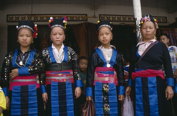 LAOS, Luang Prabang, Four Hmong girls in traditional dress.