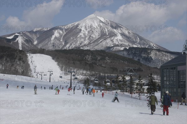 JAPAN, Fukushima, Aizu-Wakamatsu, Bandai Kogen ski resort in the winter with Mt Bandai and Bandai-Asahi National Park in the background