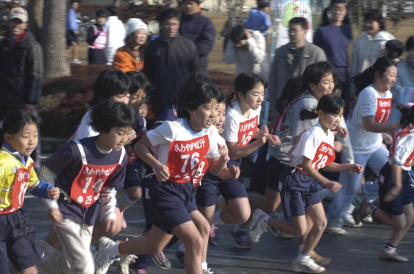 JAPAN, Chiba, Tako, Girls await the start of 2 kilometer race which is part of the towns fitness festival
