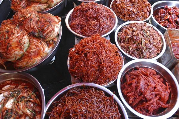 KOREA, Seoul, Namdaemun Market. Varieties of kimchi displayed on a stall