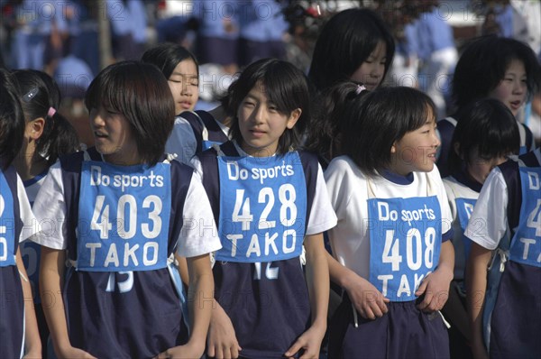 JAPAN, Chiba, Tako, 11-12 year old girls await the start of 2 kilometer race which is part of the towns fitness festival