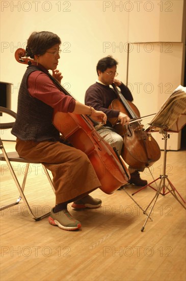 JAPAN, Chiba, Tako, "53 year old public health nurse named Teruko Ui plays cello with teacher Satoshi Miyano, at recital as a hobby and for relaxation"