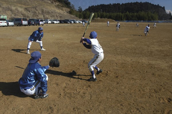 JAPAN, Chiba, Tako, "Coach Ishii checks batting form of 11 year old 5th grader, Yuki Katsumata, member of Toujou Shonen Yakyu baseball Club"