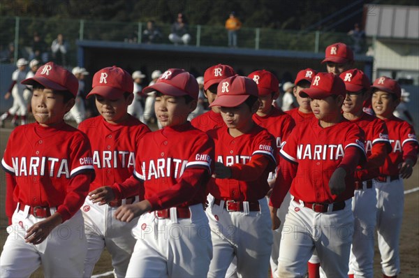 JAPAN, Chiba, Tako, A little league team from Narita parades as part of a tournament opening ceremony
