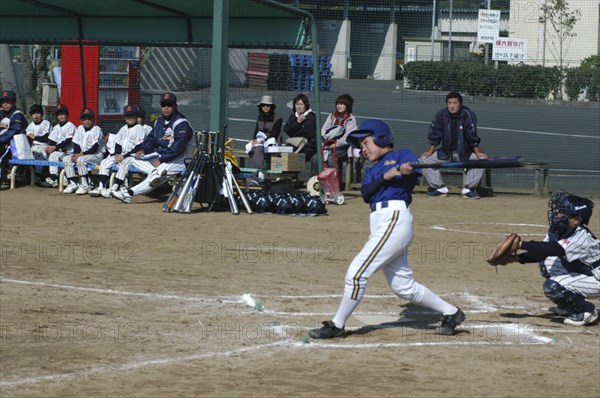 JAPAN, Chiba, Tako, "Captain Toshiki Hagiwara, 12 year old 6th grader,  watches the ball go for Toujou Shonen Yakyu Club, little league baseball "