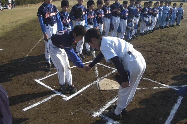 JAPAN, Chiba, Tako, "Team captain, 12 year old 6th grader, shakes hands with opposing captain from Nakamura village at home plate of Toujou Shonen Yakyu baseball Club"