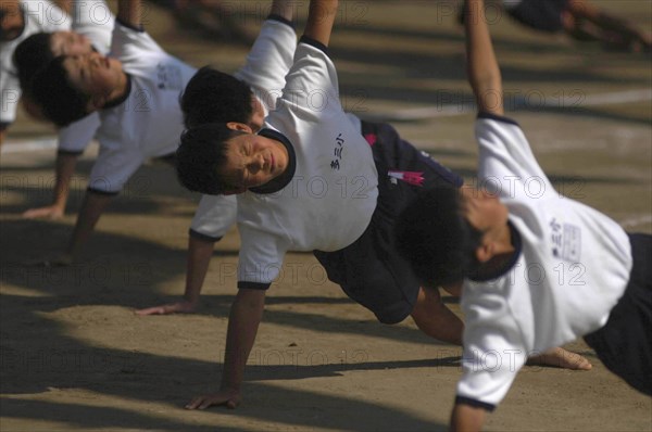JAPAN, Chiba, Tako, Tako Elemetary School Undoukai or Sports Day. 6th grade boys perform massed exercises 27 September 2003