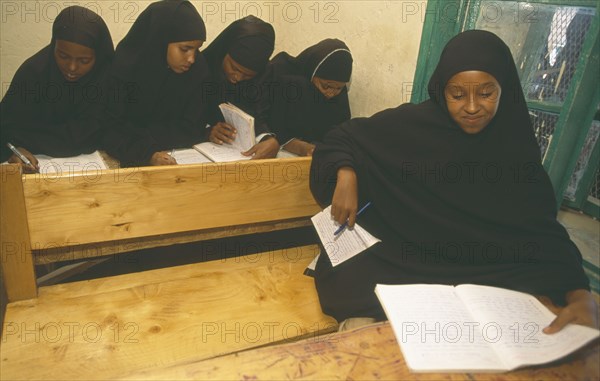 SOMALILAND, Hargeisa, Ali Osman Primary School.  Girls at desks in classroom.