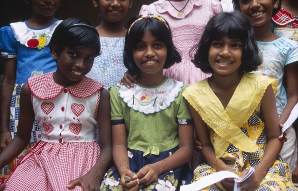 SRI LANKA, Colombo, Group of smiling orphan girls