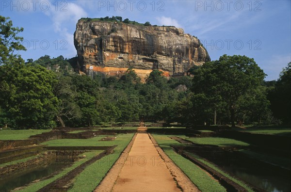 SRI LANKA, Sigiriya, View along path toward huge monolithic rock site of fifth century citadel. Also called Lion Rock.