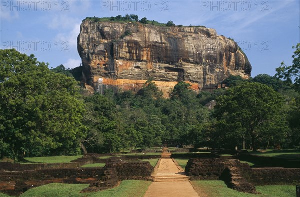 SRI LANKA, Sigiriya, View along path toward huge monolithic rock site of fifth century citadel. Also called Lion Rock.