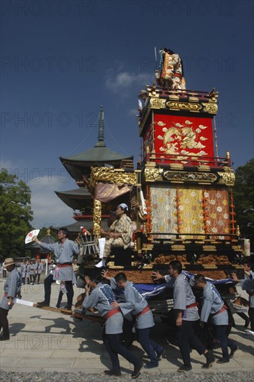 JAPAN, Chiba, Narita , Members start to pull the neighborhood dashi or wagon in front of Narita san Temple during Gion Matsuri