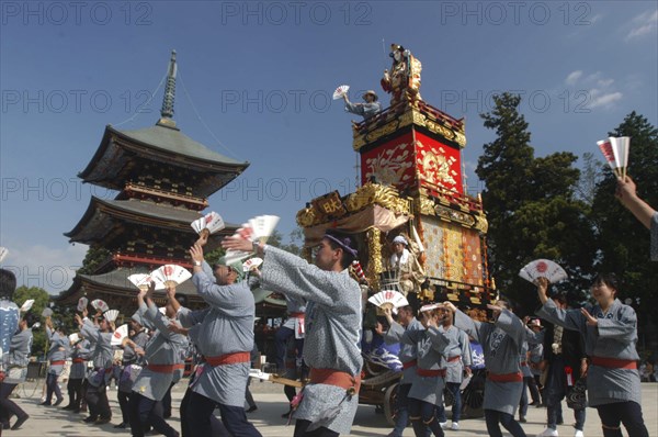 JAPAN, Chiba, Narita , Gion Matsuri. Members dance in front of Narita san Temple before pulling neighborhood dashi or wagon through the streets