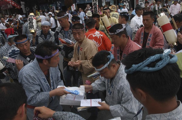 JAPAN, Chiba, Narita, "Gion Matsuri. Men in Edo-era costumes, each specific to their neighborhood, exchange gifts before starting that day's festivities"