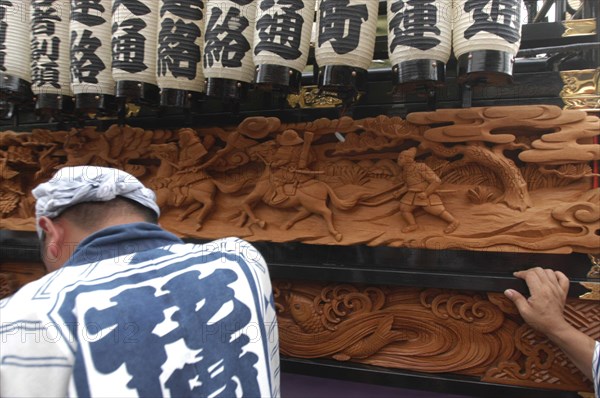 JAPAN, "Chiba,", Narita, Gion MAtsuri. Elaborate traditional wood carving detail on a panel on one of the dashi wagons
